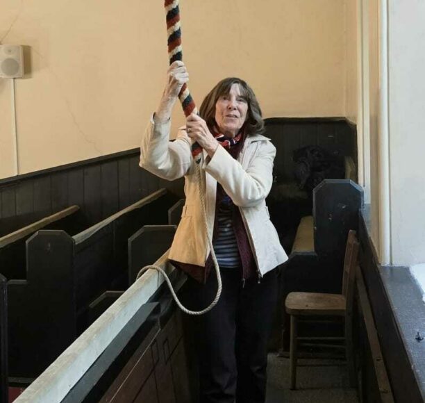 Joan ringing the bell